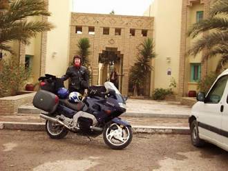 Sue and bike at hotel.